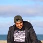 man in a hoodie with a jacket